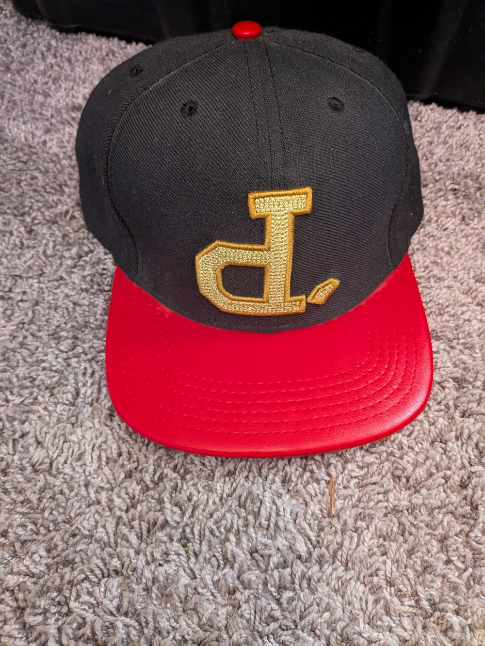 Black and Red Snapback Cap with Gold Embroidered Logo